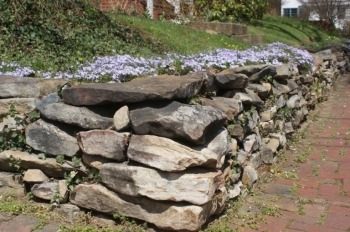 landscaping stone retaining wall around flower bed
